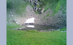  Озеро в цирке хребта Аибга (тает снежник) (слева посередине - люди